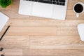 The office desk flat lay view with laptop, mouse, tree, black clip, coffee cup, notebook, pencil on wood texture background Royalty Free Stock Photo