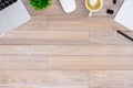 The office desk flat lay view with laptop, mouse, tree, black clip, heart latte coffee cup, notebook, pencil on wood texture Royalty Free Stock Photo