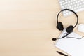 Office desk with headset and pc Royalty Free Stock Photo