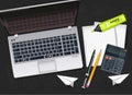 Office desk with laptop, calculator, pen and marker Vector realistic