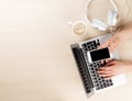 Office desk with laptop, coffee and headphones Royalty Free Stock Photo