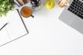 Office desk laptop computer, notebook paper, pencil, book and coffee on table. Royalty Free Stock Photo