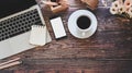 Office desk laptop, mockup smartphone and office supplies with coffee, Top view workspace wood table