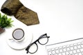 Modern white office desk top table with a cup of coffee, Necktie  and other supplies. Top view with copy space Royalty Free Stock Photo