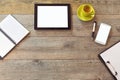 Office desk mock up template with tablet, smart phone, notebook and cup of coffee. View from above with copy space Royalty Free Stock Photo