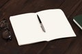 On the office desk open notebook with pen closeup Royalty Free Stock Photo