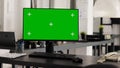 Office desk with pc running greenscreen Royalty Free Stock Photo