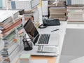 Office desk with piles of paperwork Royalty Free Stock Photo