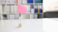 Office desk with pink sticker and paper clip Royalty Free Stock Photo