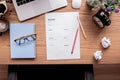 Office desk with resume paperwork and crumpled paper ball Royalty Free Stock Photo