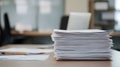 Office Desk with a Stack of Paper Documents Royalty Free Stock Photo