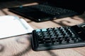 Office desk of startup businessman near the window with a laptop, books and a calculator. Business or work concept