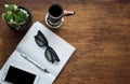 Office desk table with blank screen smart phone, notebook pen and coffee cup .Top view with copy space.Office supplies and gadgets Royalty Free Stock Photo