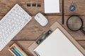 Office desk table of Business workplace and business objects of keyboard,mouse,white paper,notebook,pencil,compass on wood table Royalty Free Stock Photo