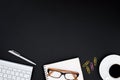 Office desk table with computer, eyeglass, silver pen, pink and Royalty Free Stock Photo