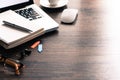 Office desk table with computer, eyeglass, white mouse, silver p