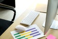 Office desk table with computer, keyboard, mouse, notebook and pink paper. Royalty Free Stock Photo
