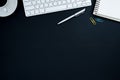 Office desk table with computer, silver pen, blue and yellow pap Royalty Free Stock Photo