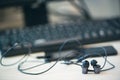 Office desk table with computer, smartphone and headphones. Essential items black color on light desk. Workplace concept Royalty Free Stock Photo