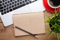 Office desk table with computer, supplies, coffee cup and flower Royalty Free Stock Photo