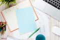 Office desk table with computer, supplies, coffee cup and flower Royalty Free Stock Photo