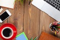 Office desk table with computer, supplies, coffee cup and flower Royalty Free Stock Photo