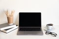 Office desk table with computer, supplies, flower and coffee cup. Top view with copy space. Royalty Free Stock Photo