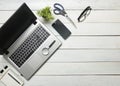 Office desk table with computer, supplies, flower. Top view. Copy space for text Royalty Free Stock Photo