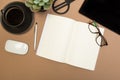 Office desk table with  notebook scissors glasses coffee cup succulent and pencil. Mock up template . Top view Royalty Free Stock Photo