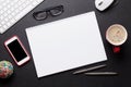 Office desk table with pc, notepad, glasses, coffee and phone