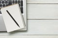 Office desk table with supplies. Top view. Copy space for text. Laptop, blank notepad, and pencil Royalty Free Stock Photo