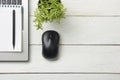 Office desk table with supplies. Top view. Copy space for text. Laptop, notepad, pen, mouse and flower. Royalty Free Stock Photo