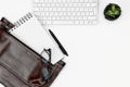 Office desk table in white color flat lay. computer keyboard, glasses, coffee and laptop case. copy space. Royalty Free Stock Photo