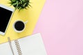 Office desk working space - Flat lay top view photo of working space with blank mock up tablet, coffee cup and notebook. Royalty Free Stock Photo