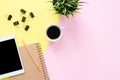 Flat lay top view photo of working space with blank mock up tablet, coffee cup and notebook. Royalty Free Stock Photo