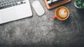 Office desk workplace with laptop, mouse, pen, note and cup of coffee Royalty Free Stock Photo