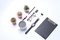 Office desk. Workspace with blank clip board, computer keyboard, office supplies, pen, green leaf, eye glassesand,watches, coffee Royalty Free Stock Photo