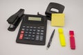 Office desktop with calculator and post it