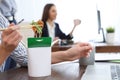 Office employee having noodles for lunch at workplace Royalty Free Stock Photo