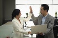 Office employees Asian women holding laptop together discuss with manager her about job project complete with perfect and do high Royalty Free Stock Photo