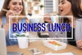 Office employees eating at workplace. Business lunch Royalty Free Stock Photo