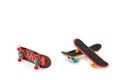 Office entertainment. Fingerboard a skateboard on white background