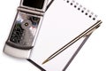 Office equipment concept - spiral notebook, pen and modern phone Royalty Free Stock Photo