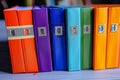 Office essentials Multi colored file folders neatly stacked on a table Royalty Free Stock Photo