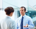 An office executive having a conversation with his team leader. Portrait of an office executive in tie having a