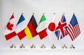 Office flags of the countries of the G7 block on a light background. Summit of USA, UK, Japan, Italy, Germany, France Royalty Free Stock Photo