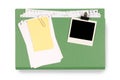 Office file folder untidy torn notepaper and yellow post-it style sticky note, blank polaroid photo frame Royalty Free Stock Photo