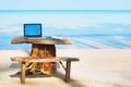 Office of freelancer on the beach, laptop computer with empty screen Royalty Free Stock Photo