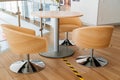 office furniture. round table and chairs made of wood on a metal leg. Royalty Free Stock Photo