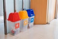 Office garbage separation campaign that prepares three separate bins of different colors symbols for easy observation